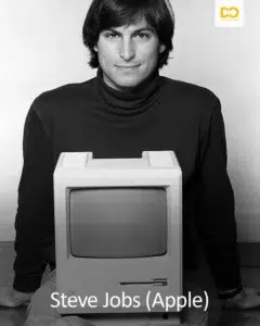 Young Steve Jobs behind the first Apple Macintosh, black and white photo